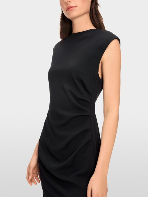 Dress with asymmetrical details