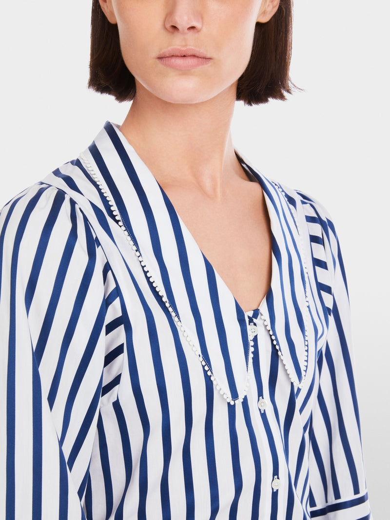 Blouse with tasselled trim